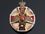 an image of a badge with a crown on it