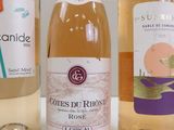 three bottles of wine that are sitting on a table