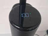 a clock on the top of a coffee maker