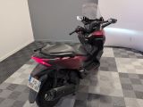 a motorcycle that is sitting on a checkered floor