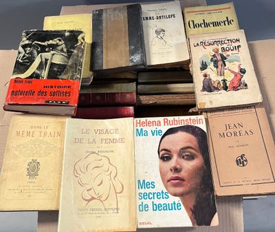 several books are stacked on top of each other on a table