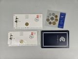 two envelopes and a coin are sitting on a table