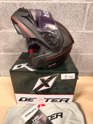 the helmet is sitting on top of the box on the table