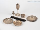 a lot of silver items that are on the table