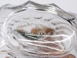 a close up view of a glass vase with a flower on it