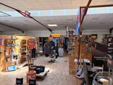 an image of a store with a lot of items on the floor