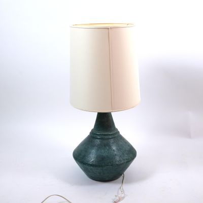 a lamp that is sitting on a table with a lamp on top of it