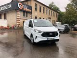 a white van that is parked in front of a building