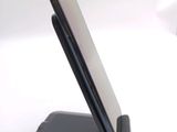 a cell phone that is sitting on top of a stand