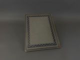 an open book sitting on top of a table next to a lamp
