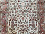 an oriental rug with a floral design on a white ground