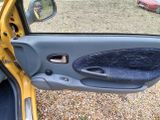 a picture of a car door with the door handle open