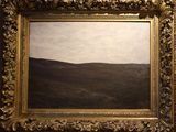 an oil painting of a landscape with hills and trees in a gold frame