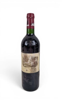a bottle of wine that is sitting on a table