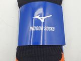 two pairs of black and orange socks are in a package
