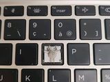 a close up of a computer keyboard with a camera on it