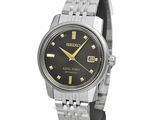 a close up of a wrist watch with a black dial