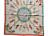 an image of a square scarf with a picture of people on it