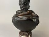 statue of a bird on a bowl with a bird on top