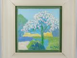 an oil painting of a tree with white flowers in a white frame