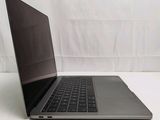 a laptop that is sitting on a white surface