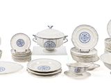 many plates and bowls that are sitting on a table