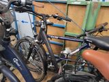 two bikes parked next to each other in a garage