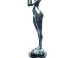 statue of a woman holding a bird in her hand on a pedestal
