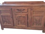a wooden cabinet with drawers and drawers on it