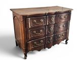 an old wooden chest of drawers with many drawers on top of it
