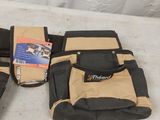 a bag of tools sitting on a table next to a pair of gloves