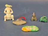 five small figurines of different shapes and sizes