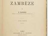 an open book on a white surface with a black and white title