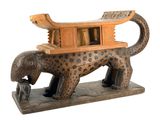 statue of a leopard with a house on its back
