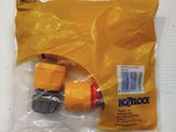 yellow plastic bag with two hoses in it sitting on a white surface