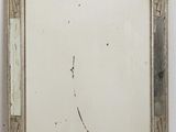 an image of a mirror hanging on a wall in a room