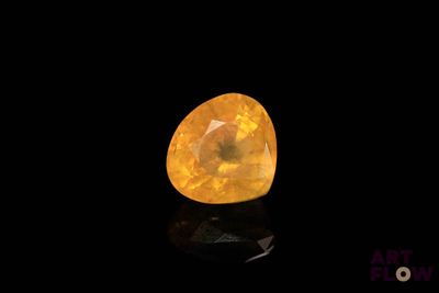 a yellow diamond on a black background