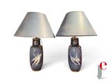 two lamps that are sitting next to each other on a table