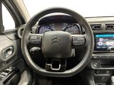 the interior of a car with a steering wheel and dashboard controls