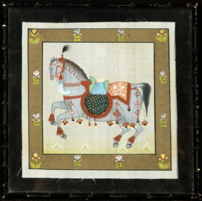 tableau représentant un cheval avec une selle, dans un cadre noir