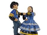 a figurine of a man and a woman dancing