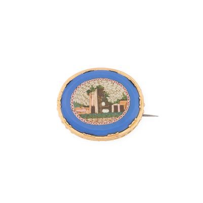 une image représentant une bague bleue et dorée sur laquelle figure une maison