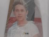 a picture of a man in a white shirt wrapped in plastic