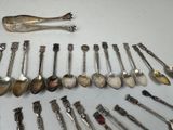 a lot of spoons and spoon spoons sitting on a table