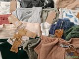a pile of clothing that is sitting on a table