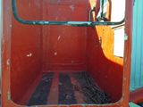 a red truck with a metal door and a window