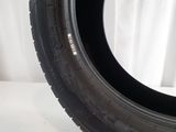 a close up of a tire on a white surface with a white background