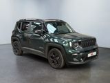 the jeep renegade is parked in a large room with a black floor