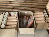several boxes filled with different types of hoses sitting on top of a floor