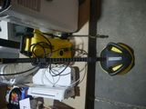 a yellow and black guitar sitting on top of a table